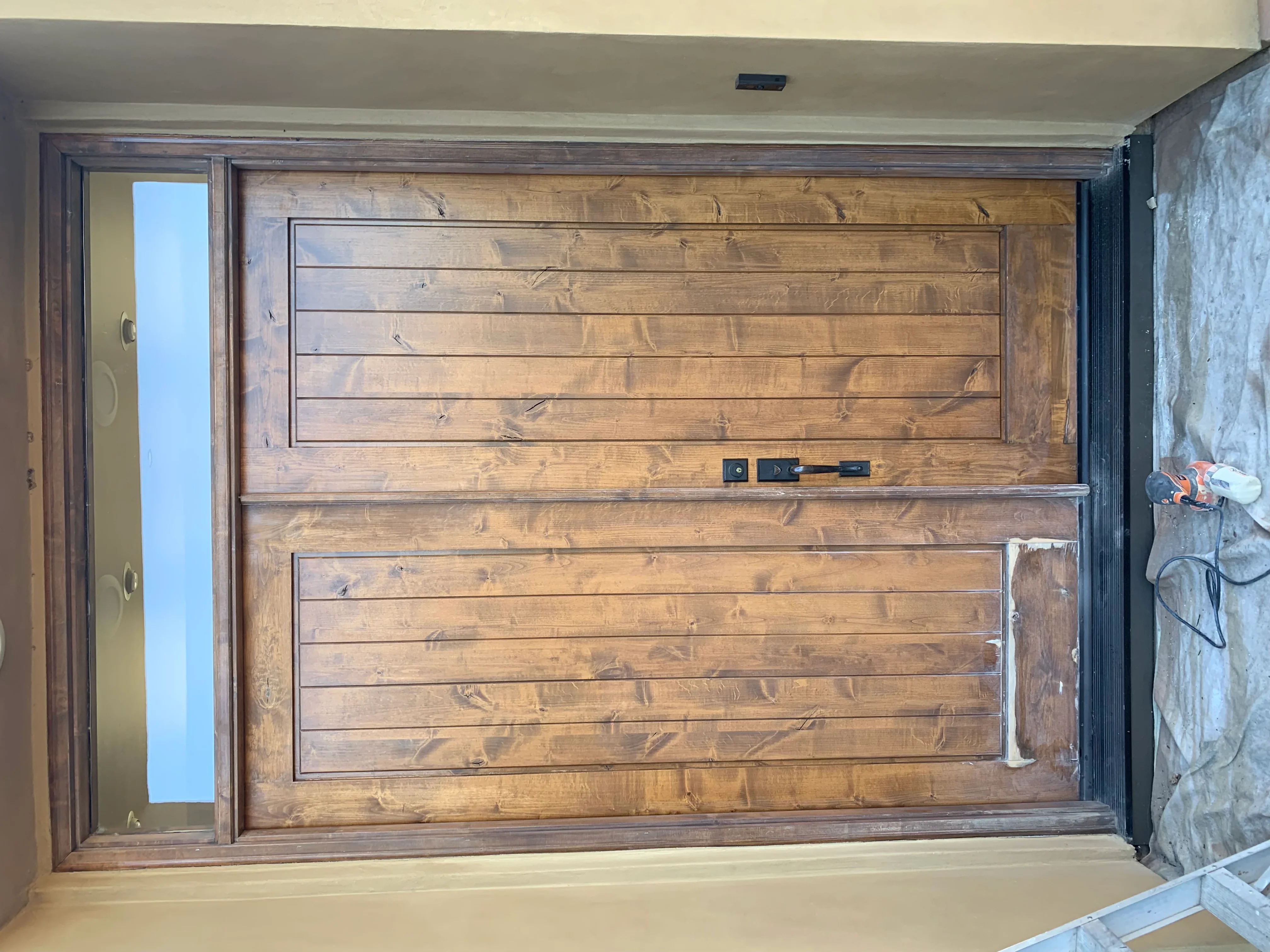 Custom wooden garage door with horizontal panels and dark stain finish in El Dorado Hills